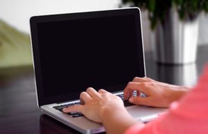 typing on laptop