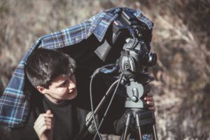 a person capturing the scene with a professional camcorder